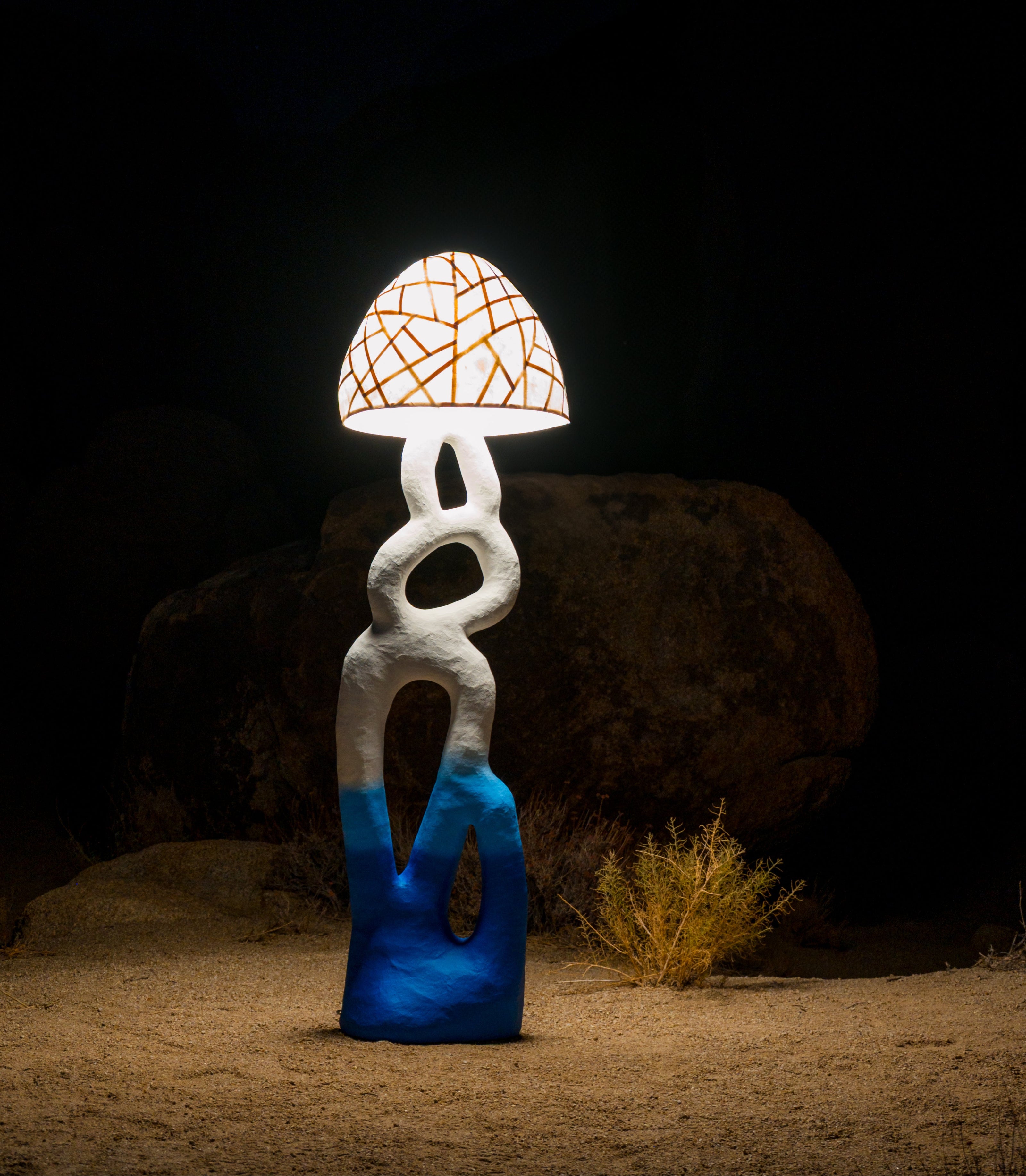 Decorative lamp with a unique design photographed at night in the desert landscape